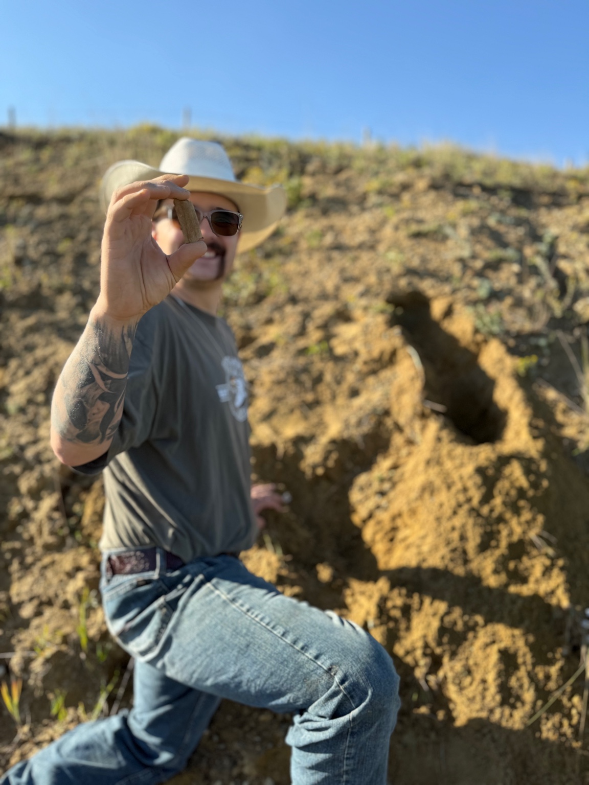Nate holding a fossil find